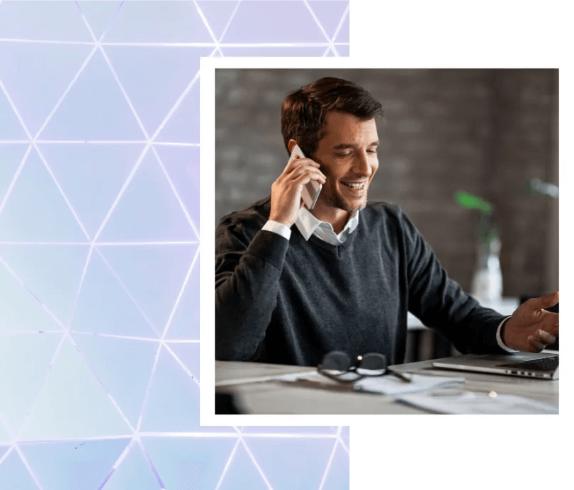 Man speaking happily on the phone to his business partner